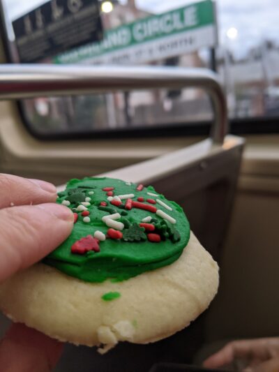 green cookie, with Cleveland circle sign out of focus in the background