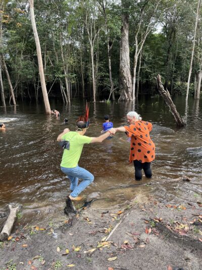 Fred wading into water