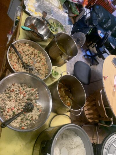 pots and pans full of pakaprow, rice, and soup