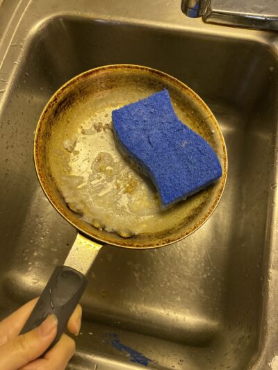 a blue sponge in a frying pan