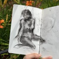 charcoal poses of a model in my sketchbook