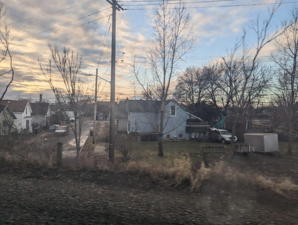 sunrise with clouds over a neighborhood