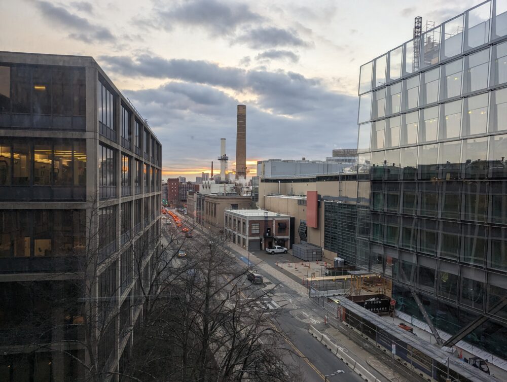 buildings and road under a cloudy sunset