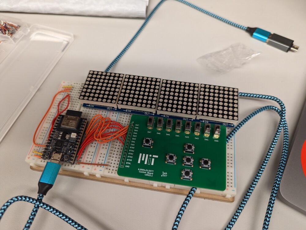 electronic breadboard with wires and some panels