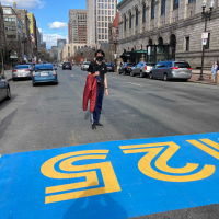 alan standing behind a painted strip on the road